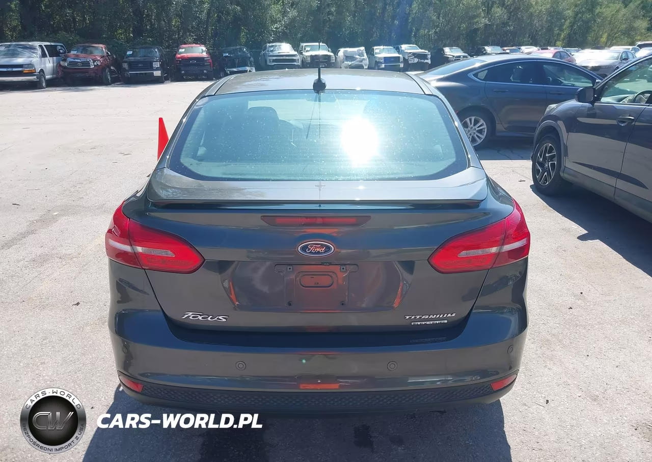2015 Ford Focus Titanium VIN:1FADP3J28FL323935 - 16