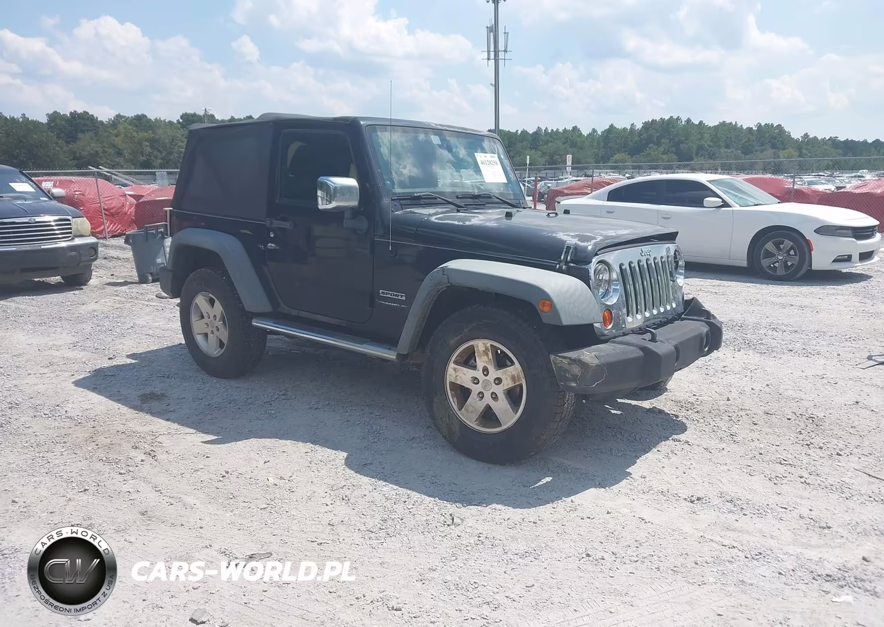 2011 Jeep Wrangler Sport VIN:1J4AA2D18BL630991 - 1