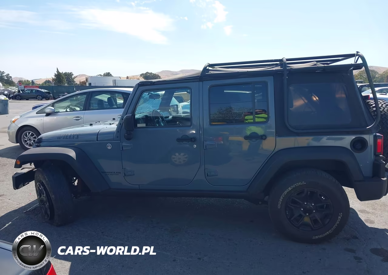 2014 Jeep Wrangler Unlimited Willys Wheeler VIN:1C4BJWDG0EL309747 - 14