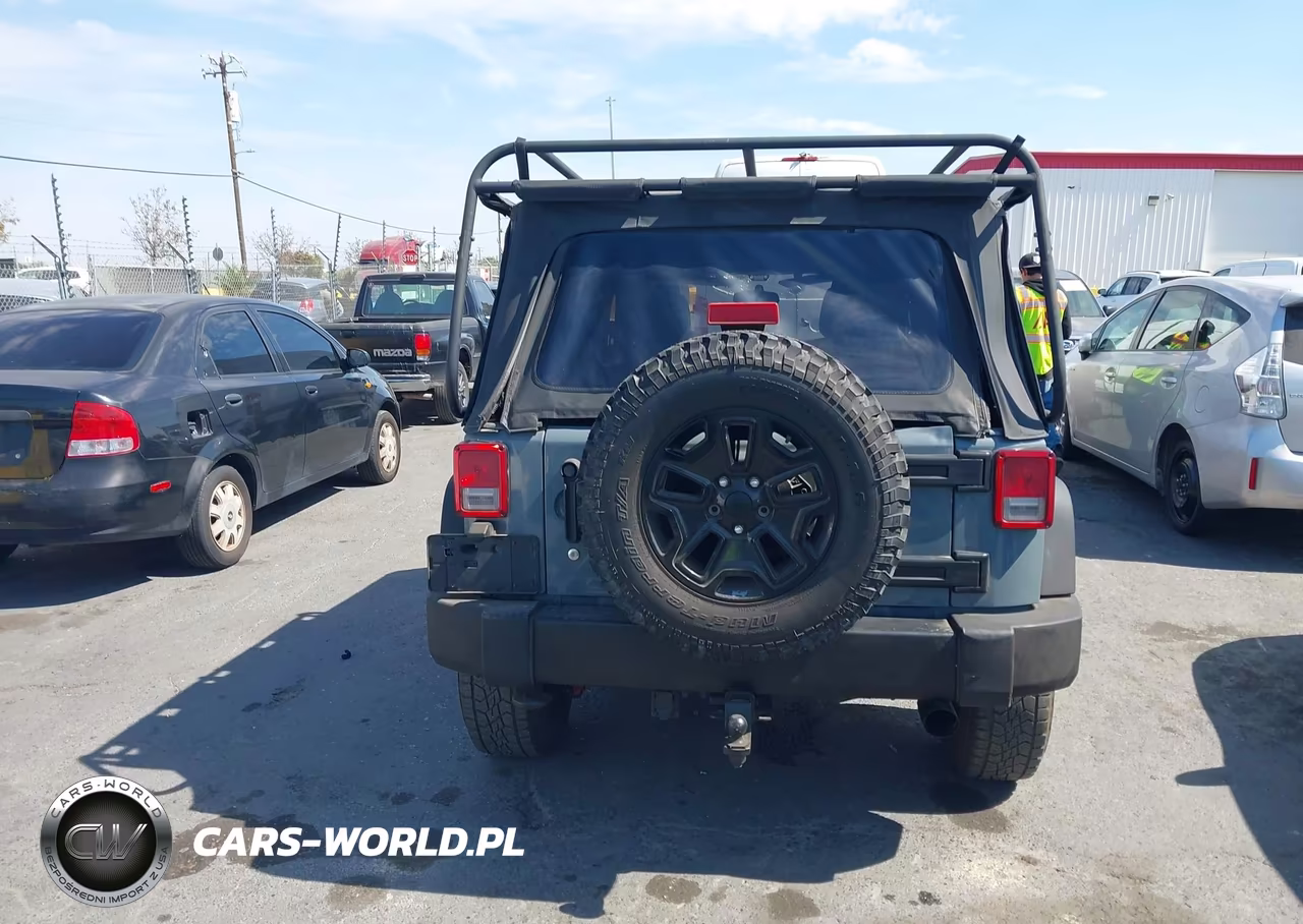 2014 Jeep Wrangler Unlimited Willys Wheeler VIN:1C4BJWDG0EL309747 - 16