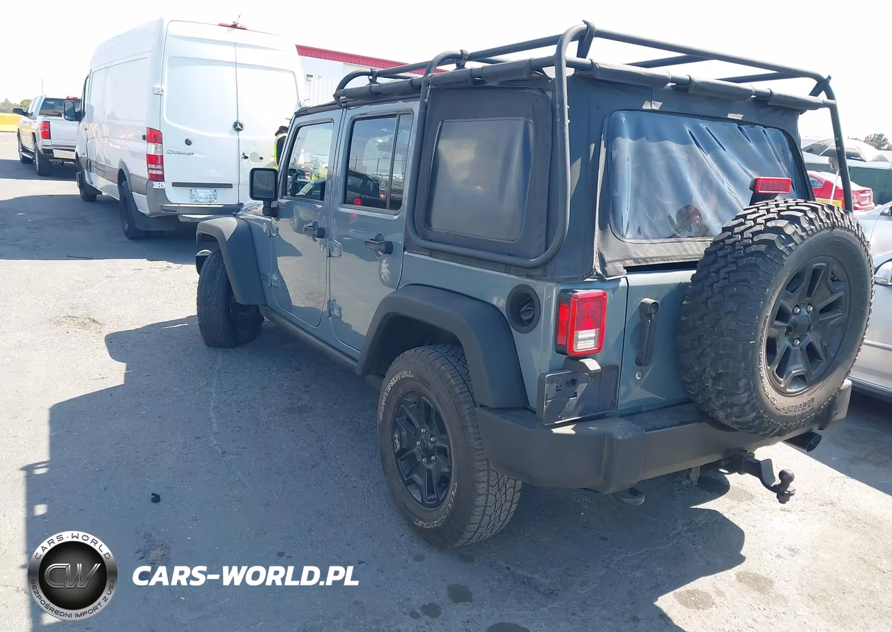 2014 Jeep Wrangler Unlimited Willys Wheeler VIN:1C4BJWDG0EL309747 - 3