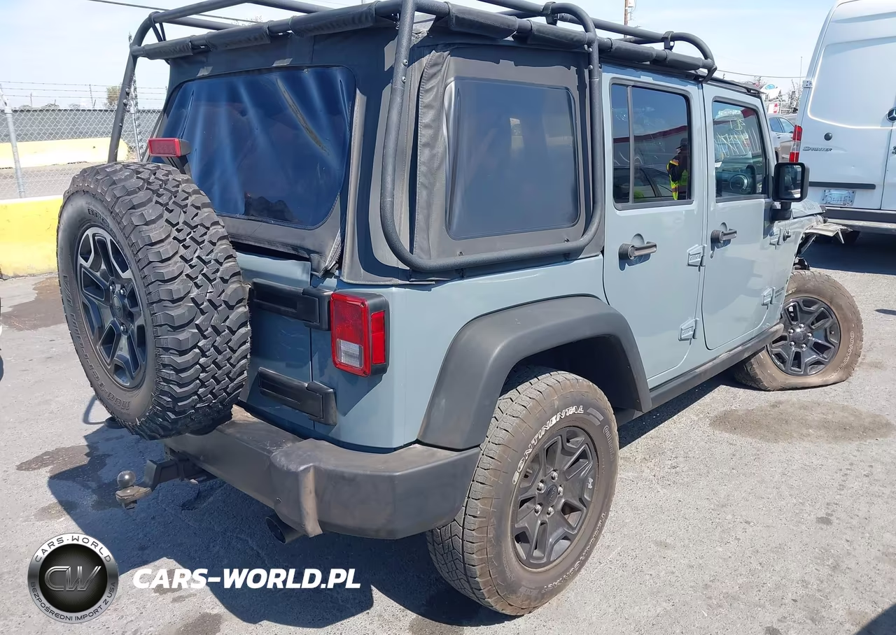 2014 Jeep Wrangler Unlimited Willys Wheeler VIN:1C4BJWDG0EL309747 - 4