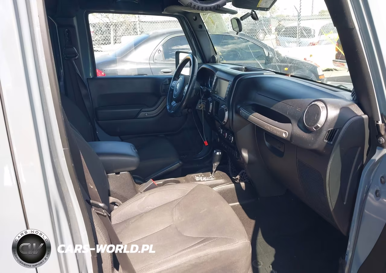 2014 Jeep Wrangler Unlimited Willys Wheeler VIN:1C4BJWDG0EL309747 - 5