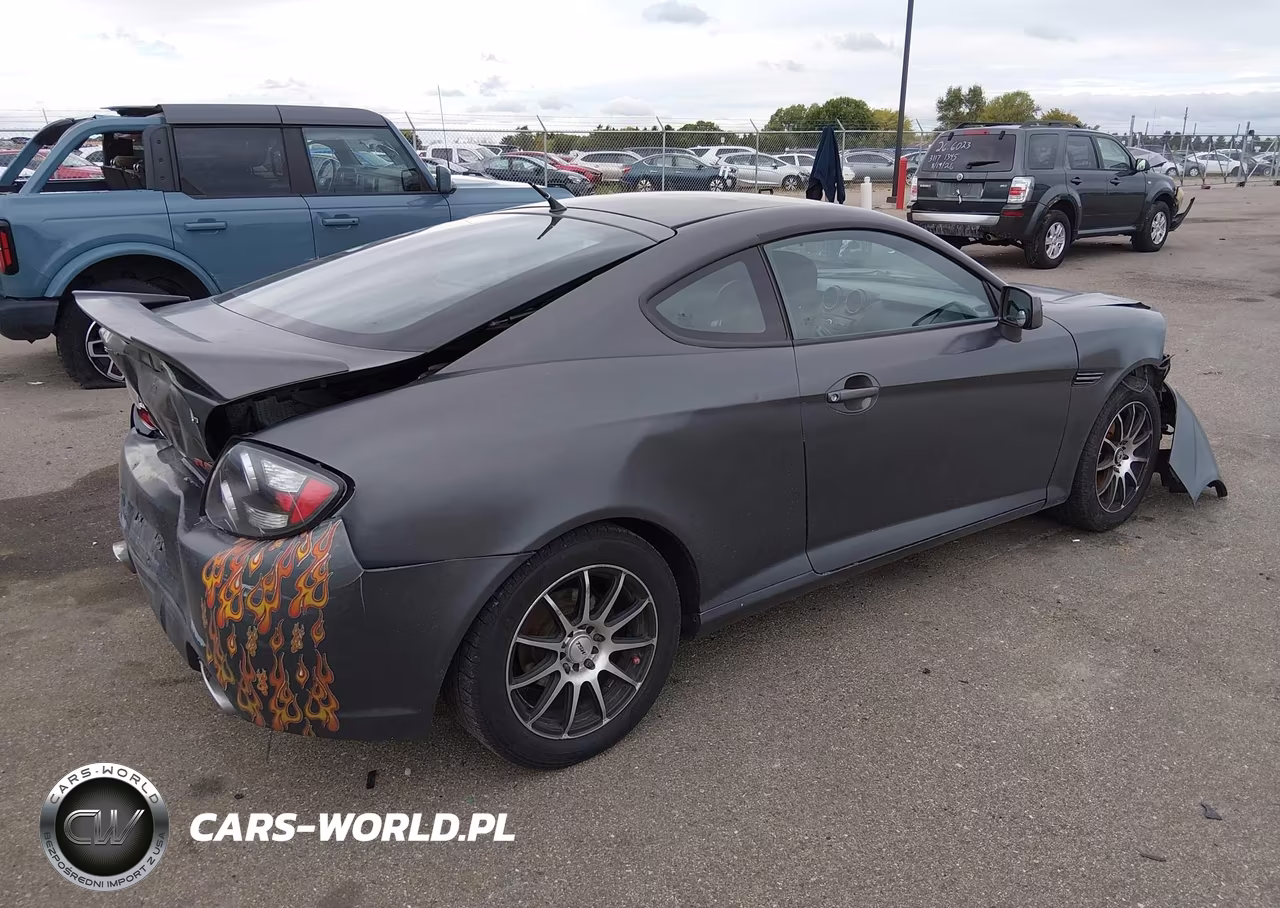 2007 Hyundai Tiburon Gs VIN:KMHHM66D67U260390 - 4