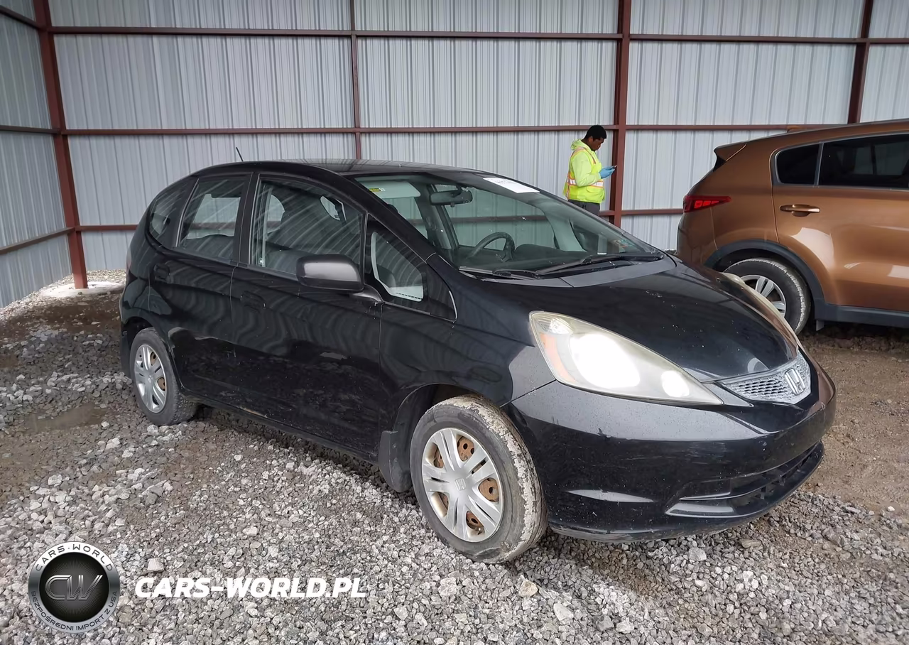 2009 Honda Fit VIN:JHMGE87299S061093 - 1