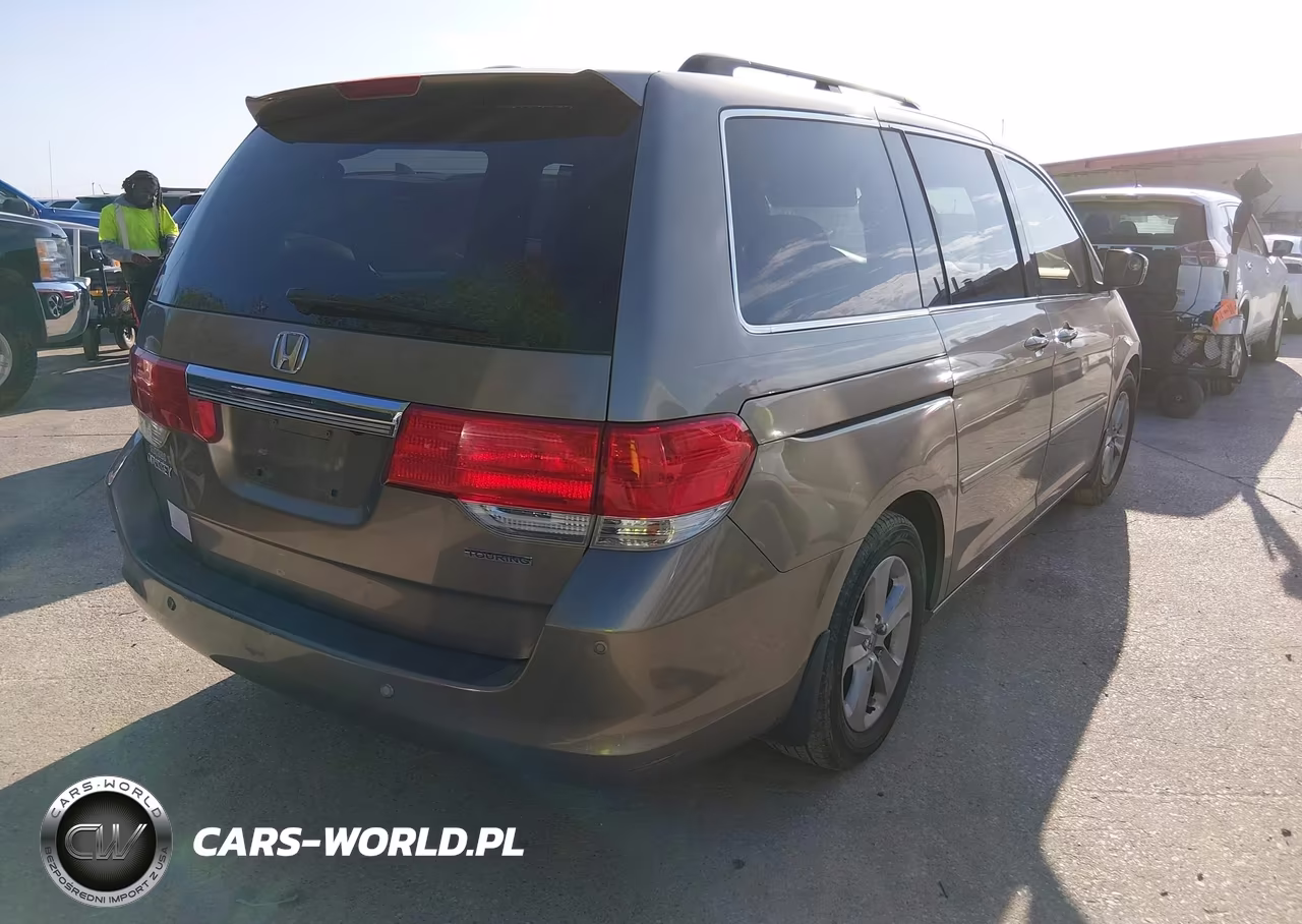 2010 Honda Odyssey Touring VIN:5FNRL3H93AB055709 - 4