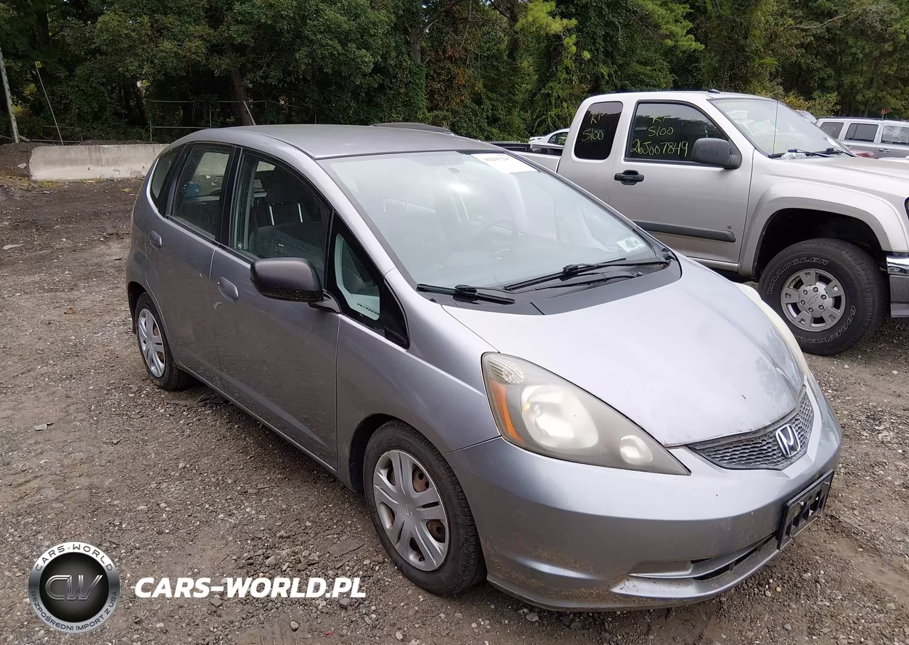 2009 Honda Fit VIN:JHMGE88259S055015 - 1