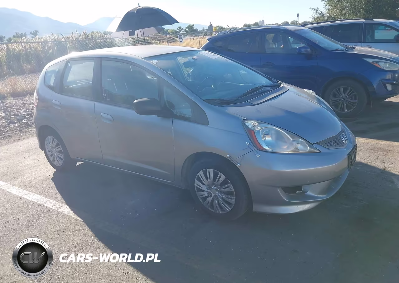 2009 Honda Fit VIN:JHMGE88239S056972 - 1