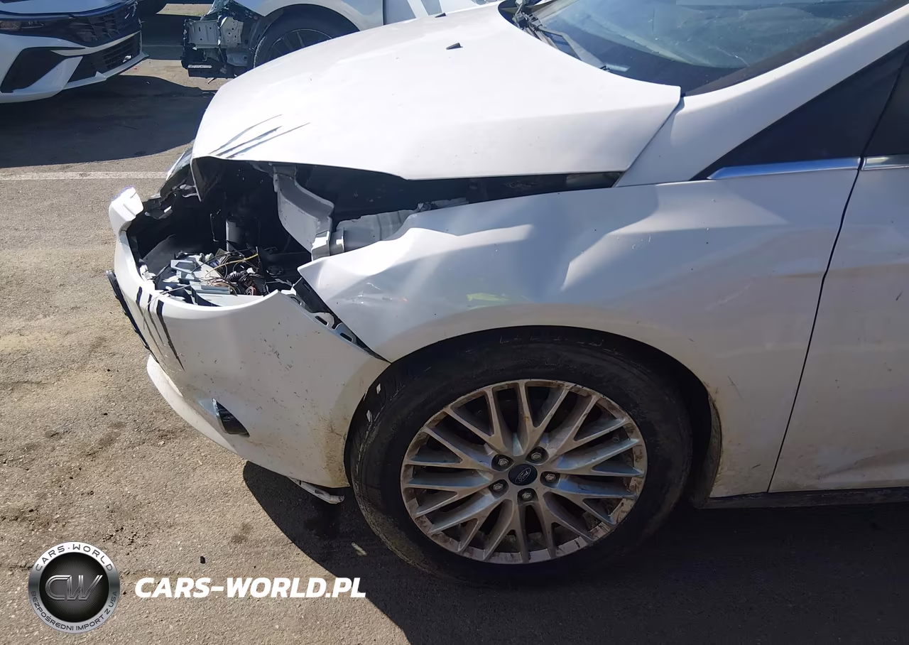 2013 Ford Focus Titanium VIN:1FADP3J23DL198694 - 16