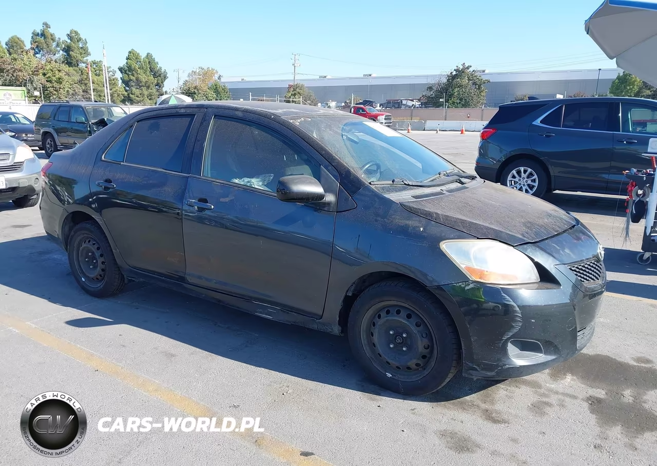2009 Toyota Yaris VIN:JTDBT903991299896 - 1