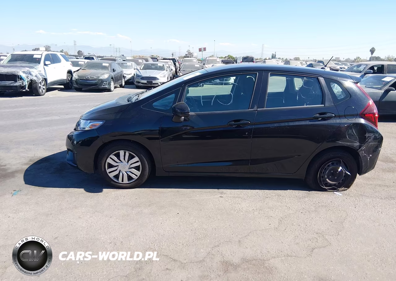 2015 Honda Fit Lx VIN:3HGGK5H58FM717677 - 14