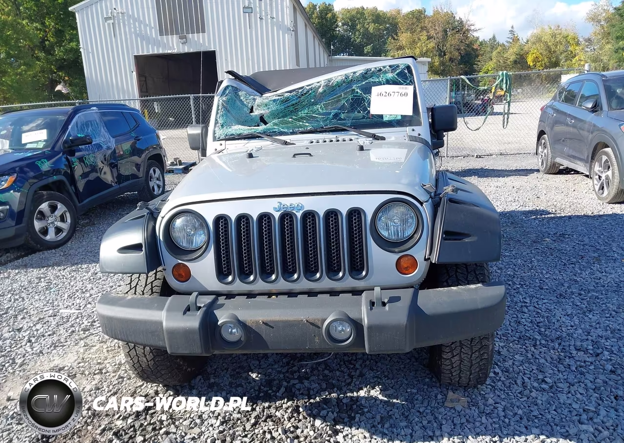 2011 Jeep Wrangler Sport VIN:1J4AA2D11BL502673 - 12