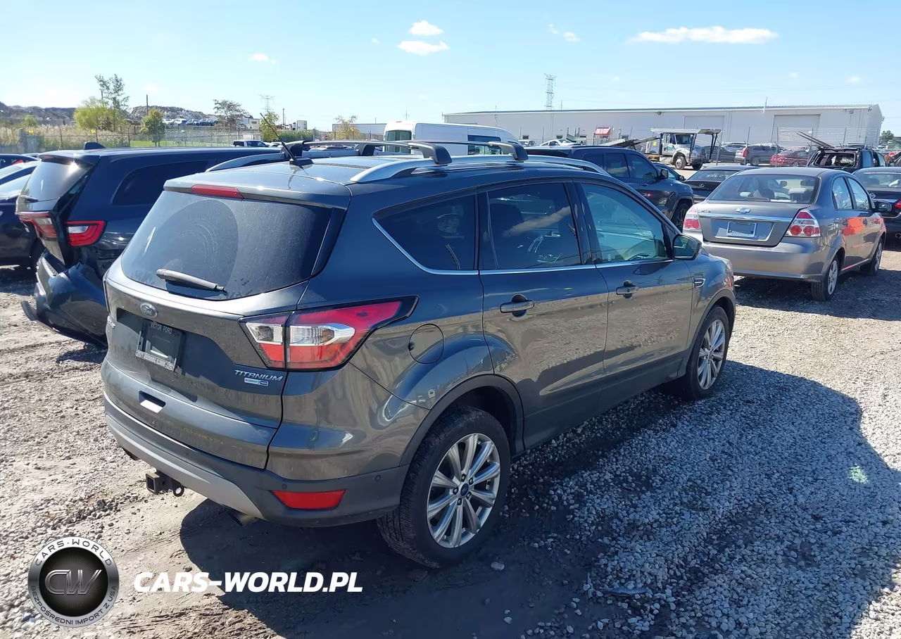 2017 Ford Escape Titanium VIN:1FMCU9J9XHUB65976 - 4