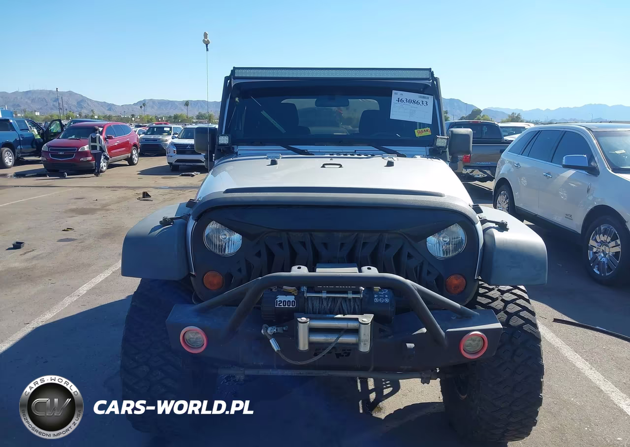 2011 Jeep Wrangler Sport VIN:1J4AA2D16BL619486 - 12