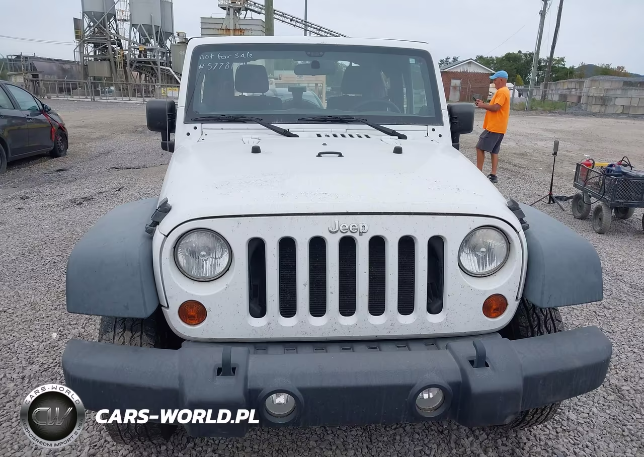 2011 Jeep Wrangler Sport VIN:1J4AA2D14BL577819 - 12