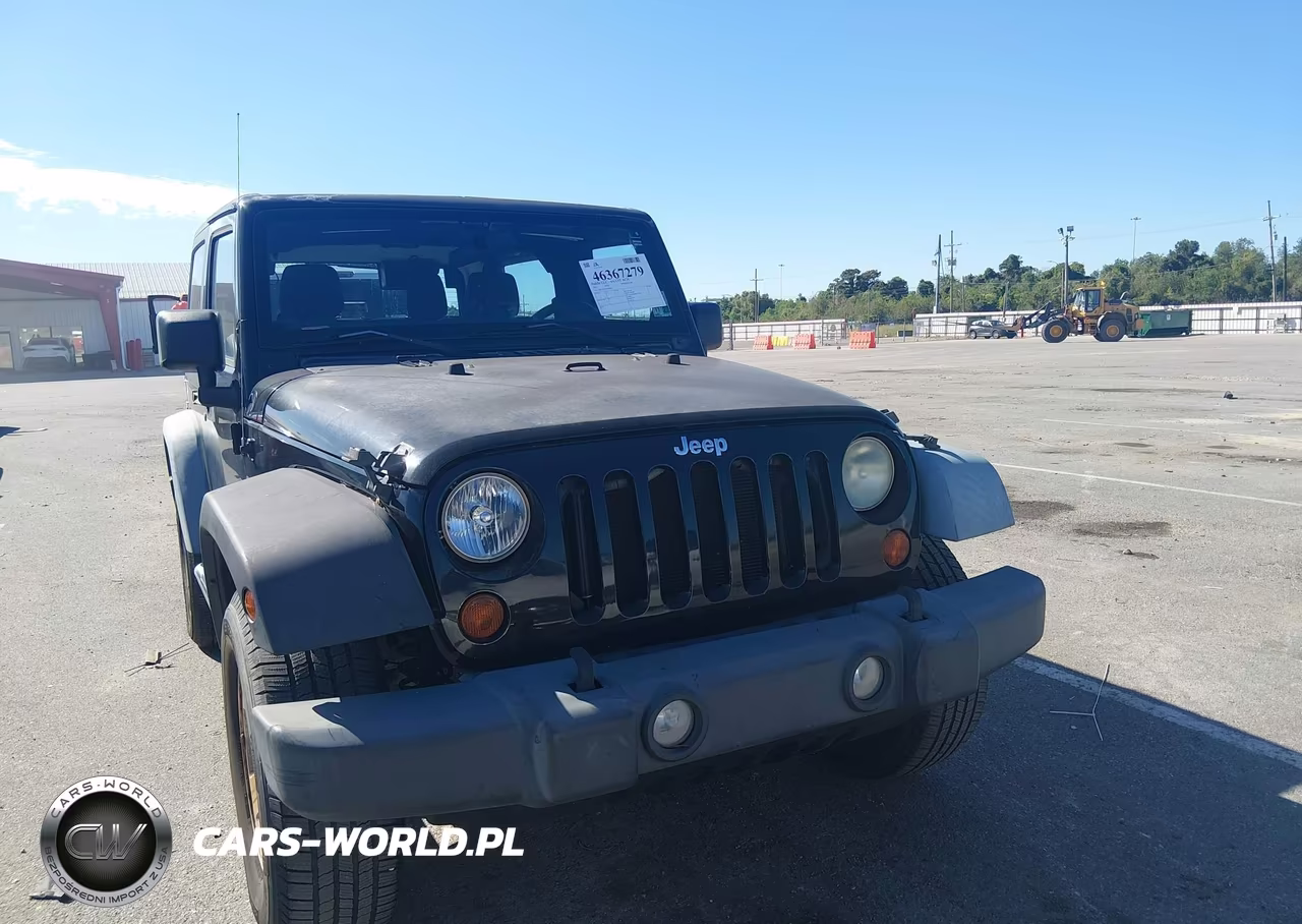 2011 Jeep Wrangler Sport VIN:1J4GA2D12BL606809 - 12