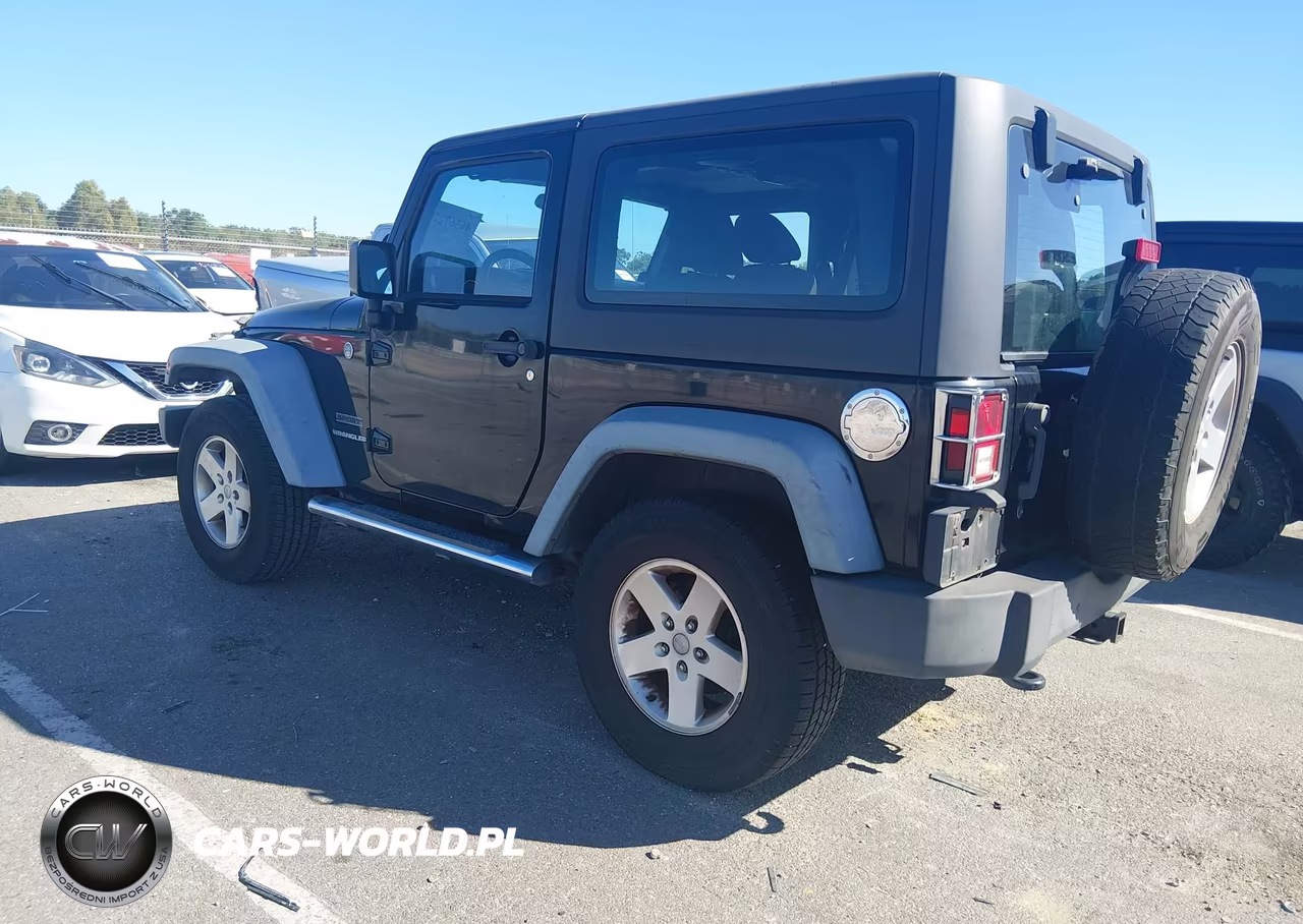 2011 Jeep Wrangler Sport VIN:1J4GA2D12BL606809 - 3