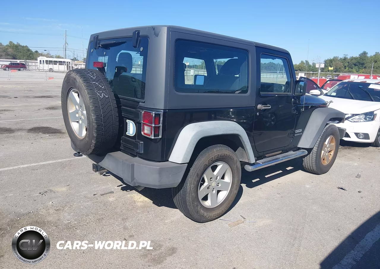 2011 Jeep Wrangler Sport VIN:1J4GA2D12BL606809 - 4