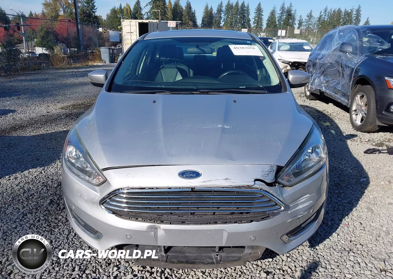2015 Ford Focus Titanium VIN:1FADP3J20FL324108 - 12