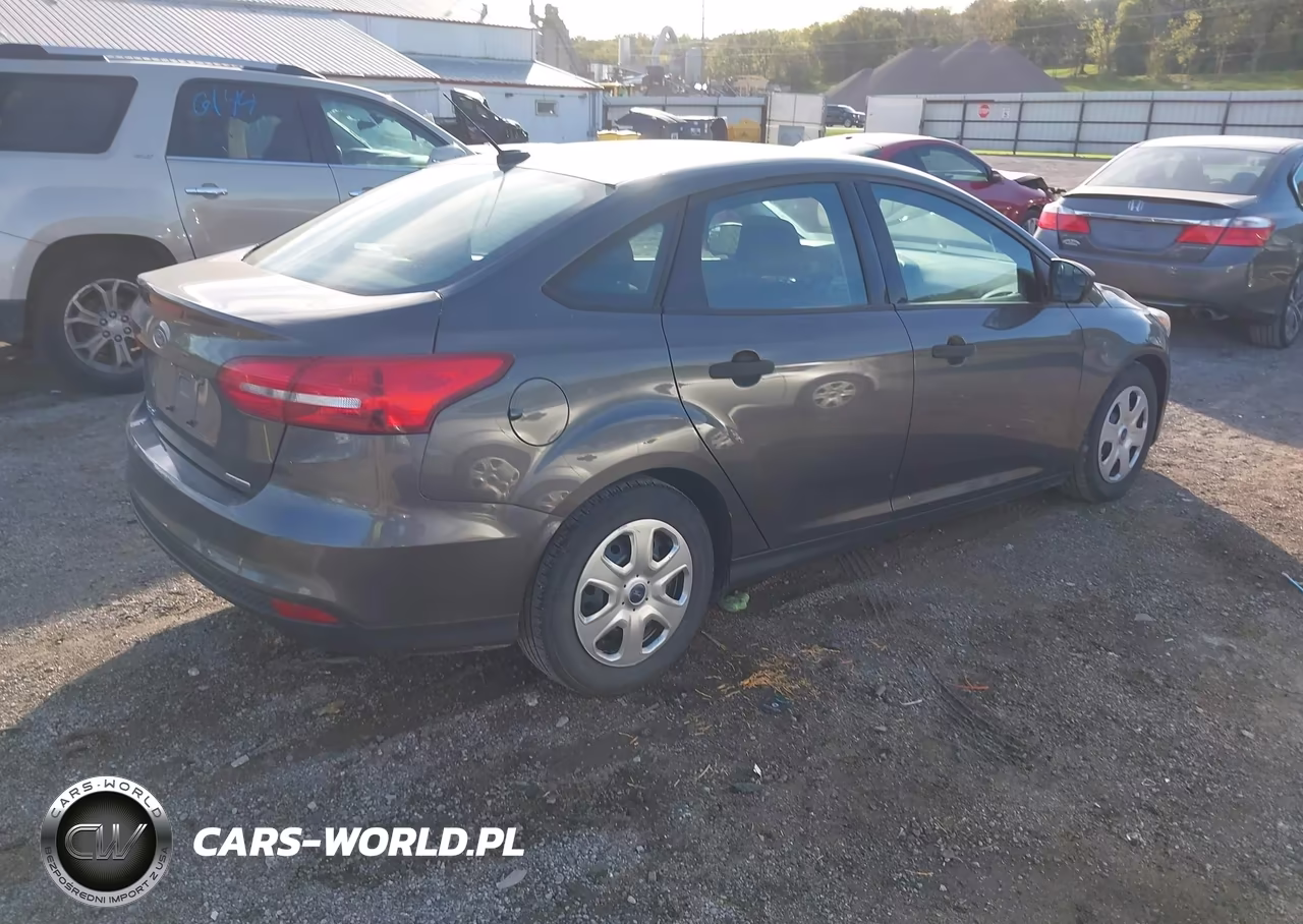 2015 Ford Focus S VIN:1FADP3E21FL357337 - 4