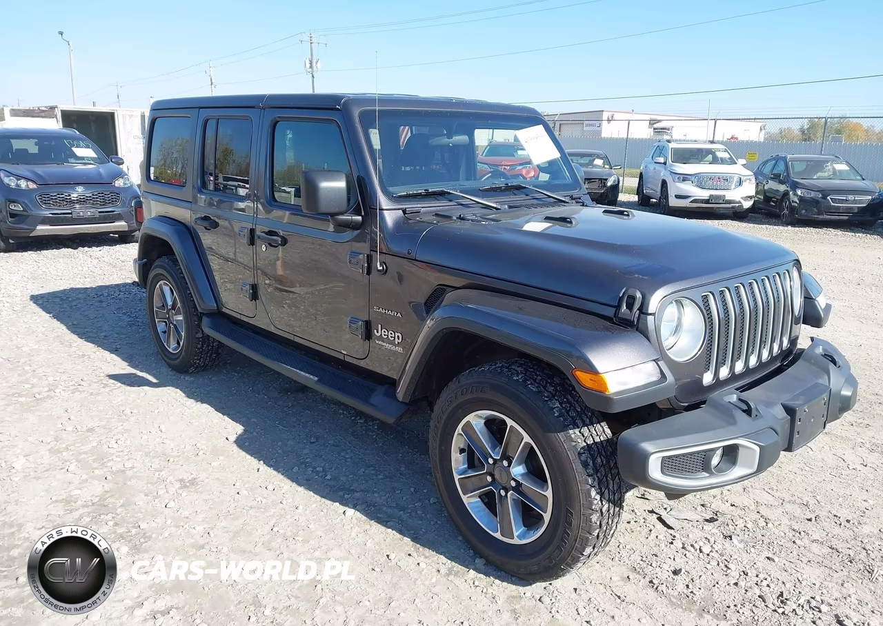 2019 Jeep Wrangler Unlimited Sahara 4X4 VIN:1C4HJXEN2KW590148 - 1