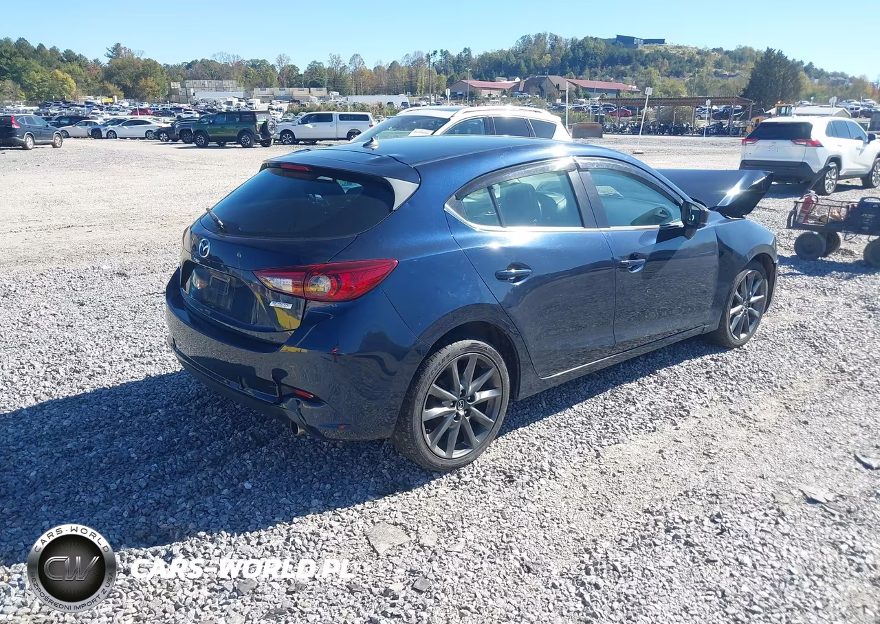 2018 Mazda Mazda3 Touring VIN:3MZBN1L35JM212992 - 4