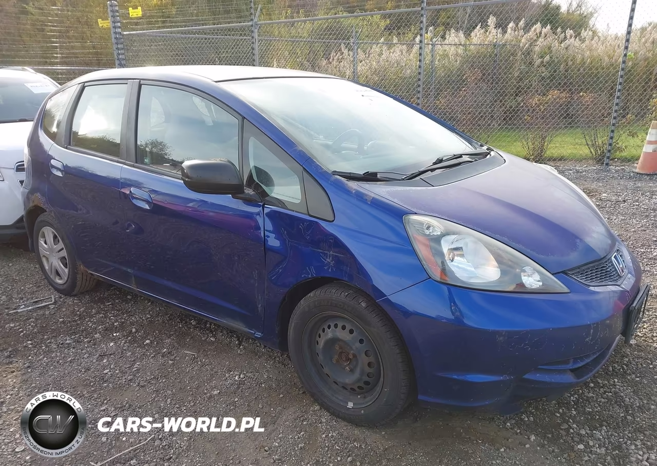 2009 Honda Fit VIN:JHMGE88299S062338 - 1