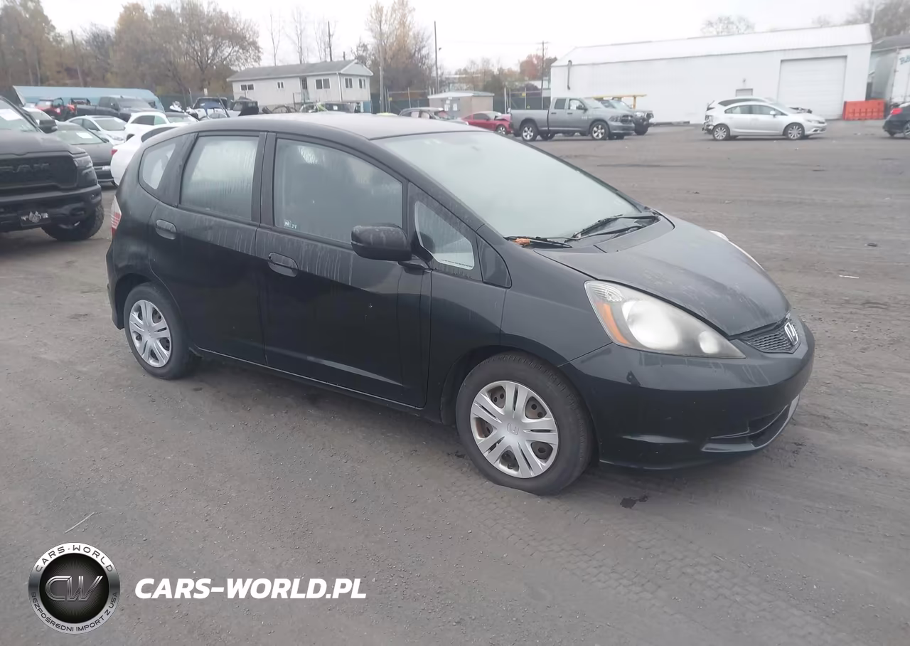 2009 Honda Fit VIN:JHMGE87219S038584 - 1